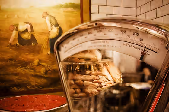 Lyonnaise cuisine — A bit of praline, some bread, some wheat, & one of the blurry people reading a newspaper...