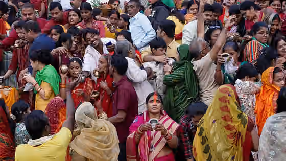 orang Bhojpuri — People waiting for the sun to rise at Chat puja, Women and also men wait the whole night fasting for the sun to rise for bathing in the river and braking their fast