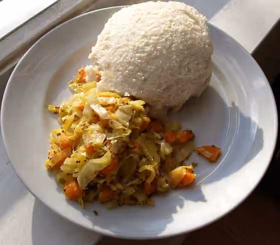 ugali — Uglai and cabbage.