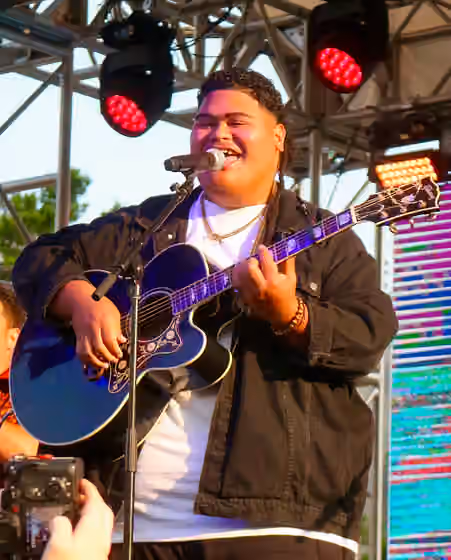 Tongans in Hawaii — Iam Tongi performs at the 2025 19/Idol/BMG CMA Fest Takeover in Nashville, TN.