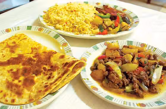 Djiboutian cuisine — Djiboutian rice (bariis) and fish (kalluun), Liver (beerka) with vegetable also (Sabaayad) pancakes.