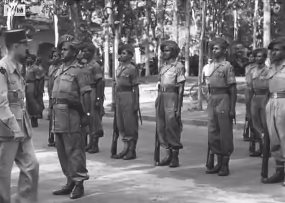 Indians in Vietnam — General Leclerc reviews troops of the 20th Indian Division, Saigon, French Indochina, 22 December 1945.