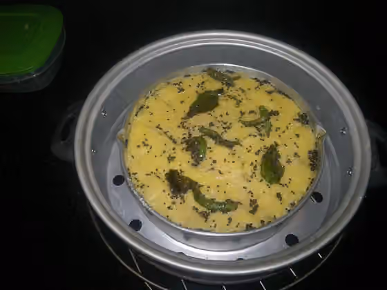 Dhokla — this is what 'nylon khaman dhokla' looks like before it is cut up into convenient,bite-sized pieces.