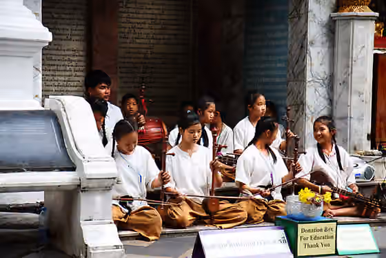 Khrueang sai — Temple girls and boys playing instruments in Thailand, 2008.