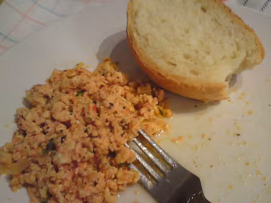 Strapatsada — A quick Greek meal made from eggs scrambled in olive oil, fresh tomato puree and herbs (oregano, thyme or other).