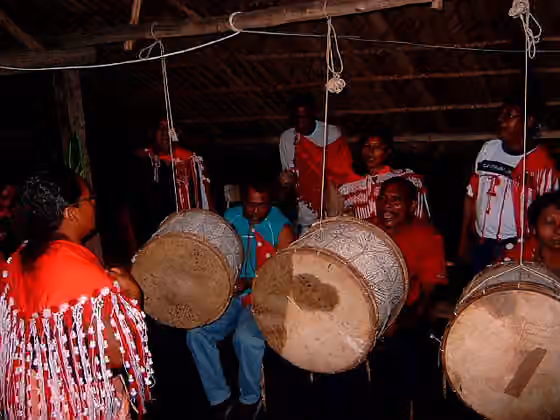 Kalina people — A group of Carib Amerindians from Suriname (the village of Bigi Poika), playing the huge drums, called ' sambura .
