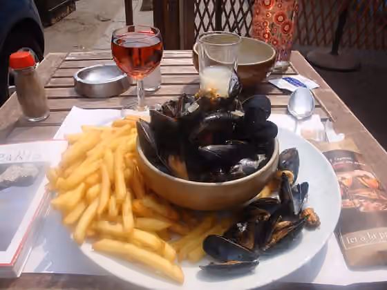 Hidangan Belgia — A meal of moules frites, Moules Mariniere and fries, with watered pastis and glass of rose.