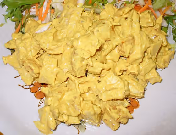 Coronation chicken — A plate of Coronation Chicken with a salad.