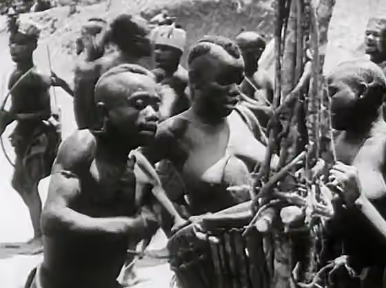 Pygmy music — Low resolution screenshot of Pygmy drummers and dancers from the American public domain film Africa Speaks!