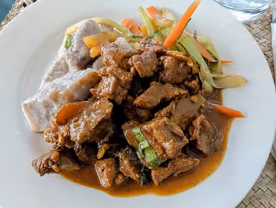 Vanuatuan cuisine — Curry of Vanuatu beef with taro boiled in coconut and island vegetables.