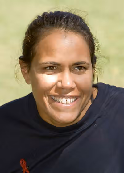 Kuku Yalanji — Cathy Freeman wears a t-shirt with the message 'Don't look down on anybody unless you are helping them up.' The Australian Olympian was a guest of the Australian Government's aid program to PNG in May 2008, where she met with people living…