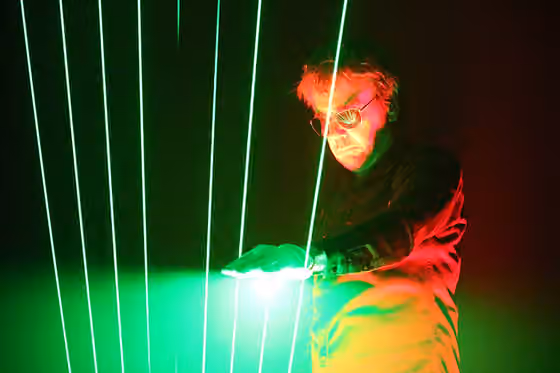 Musik luar angkasa — Jean-Michel Jarre playing on laserharp at a concert in Bratislava, 2016.