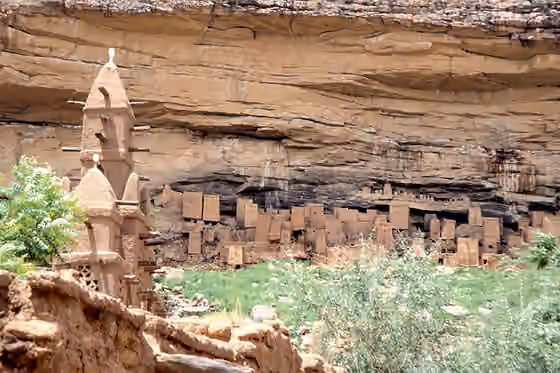 Tellem — Background: the remnant of the dwelling of the ancient Tellem people by the Bandiagara Escarpment, Dogon country, Mali.