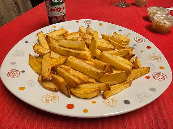 kentang goreng — Porción de papas fritas.