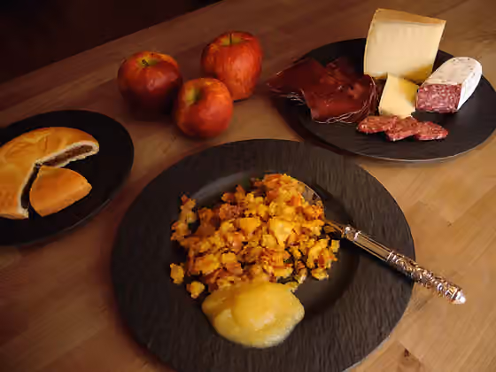 Maluns — A dish of Maluns and apple compote.
