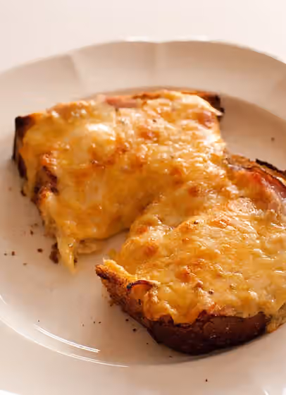 Cheese on toast — A plate of cheese on toast.