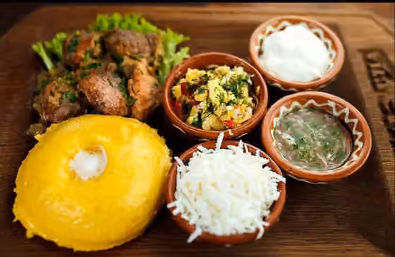 Moldovan cuisine — Mămăligă is a porridge made out of yellow maize flour, traditional in Moldova.