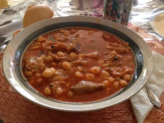 Menudo — Menudo, a typical Mexican soup made with tripe, hominy, and chile.