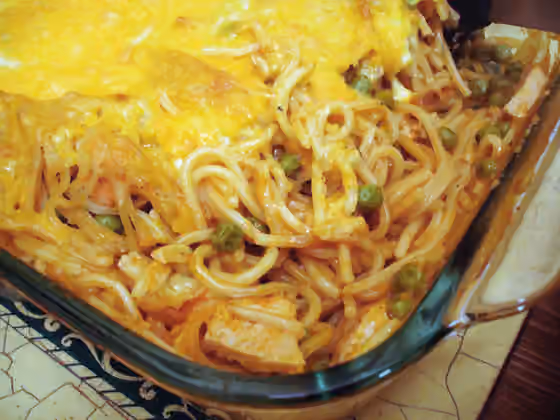 Tetrazzini — Tetrazzini is an American dish usually involving a non-red meat (often diced fowl or seafood), mushrooms, and almonds in a butter/cream and parmesan sauce flavored with wine or sherry and stock vegetables such as onions, celery, and…