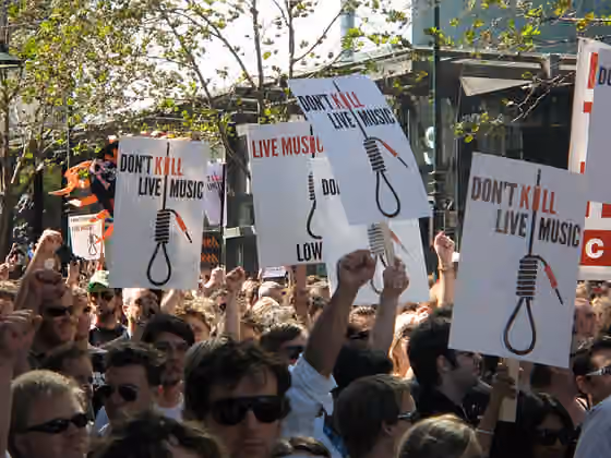 Musik di Australia — SLAM posters at the SLAM rally heading south down Swanston Street, Melbourne, Australia.