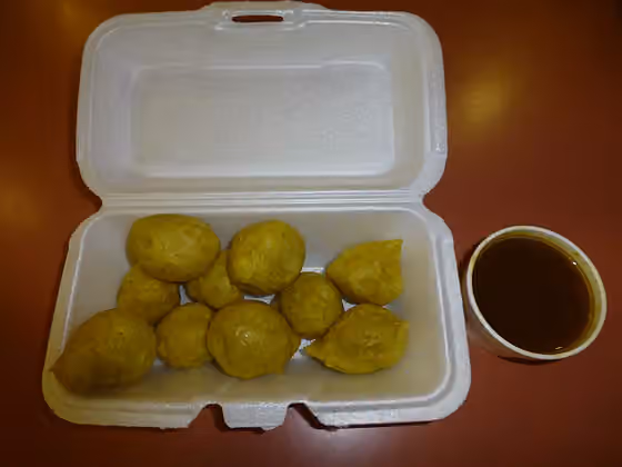 Pholourie — Pholourie with curry dip.