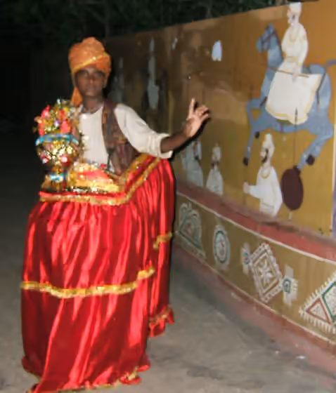 Kachchhi Ghodi dance — Out from the kitchen and dining area, we come across this 'kachhi ghodi' dancer doing his act in front of more Rajasthan style paintings.