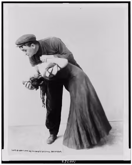 Apache (dance) — Title: Molasso and Corio, dance team in apache-type costume and pose Abstract/medium: 1 photographic print.