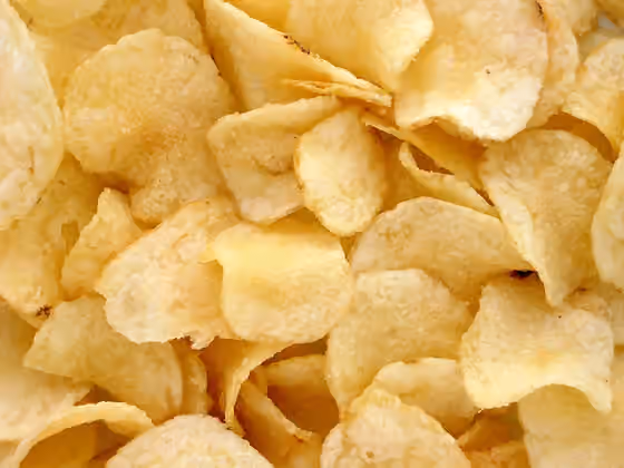 Keripik kentang — A pile of potato chips.