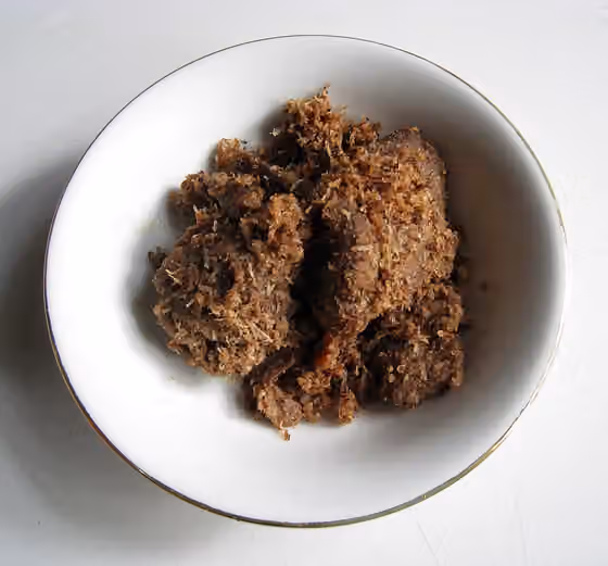 Serundeng — Serundeng Daging, fried beef in sauteed grated coconut and spices.