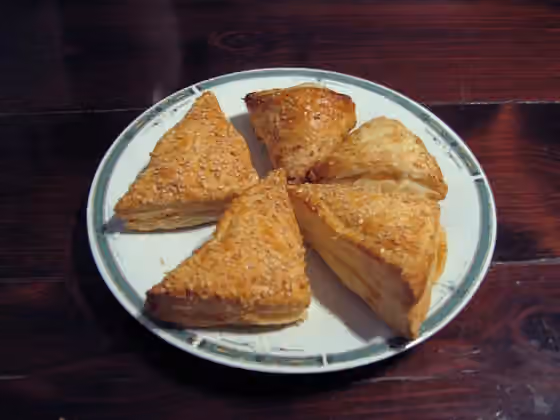 Bourekas — A Photograph of three small Cheese Bourekases and Two "Turkish" Potato-filled Bourekases from Israel.