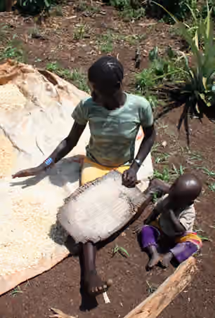 Shabo people — A Sabu woman from southwestern Ethiopia sieving corn.