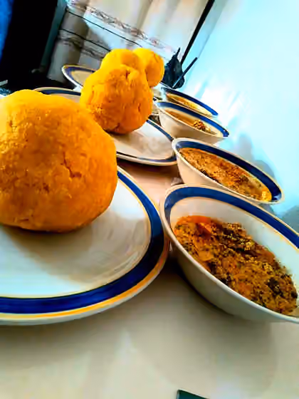 Eba — Egusi Soup and Eba is enjoyed by Many in Nigeria.