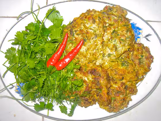 Chả rươi — Grilled clam worms with the ingredients: clam worms, lean meat shavings, eggs, citrus peel, onion, cumin and chili peppers.