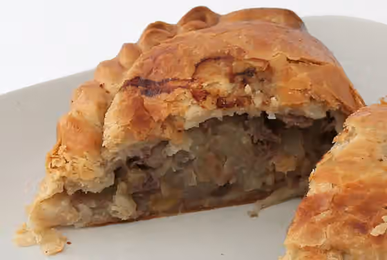 Cornish cuisine — A Cornish pasty made by Warrens cut in half.