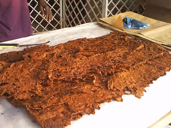 Kilishi — Kilishi is made from sliced and dried beef, coated with peanut paste "Labu" in Hausa.