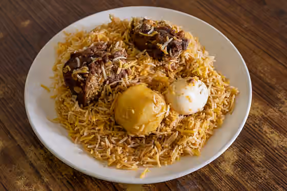 Kolkata biryani — Kolkata Biryani with two pieces of mutton (goat meat), an egg and a potato