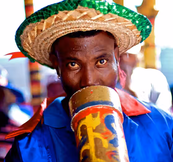 Rara music — Musician playing a Bamboo horn called Vaksen