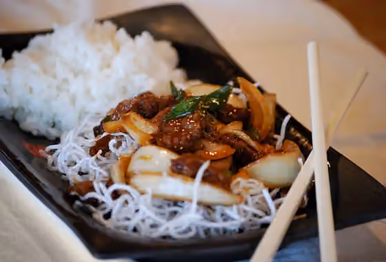 Mongolian beef — Crock pot Mongolian beef over rice noodles served with white rice.
