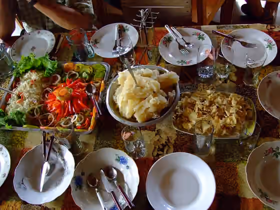 Cuban cuisine — Cuban-Creole cuisine: (left to right): raw and cooked vegetables, cooked manioc and manioc chips.