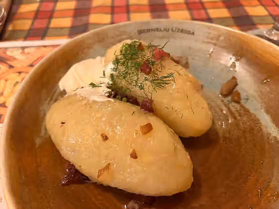 Lithuanian cuisine — Cepelinai , a traditional Lithuanian dish, as served in a restaurant in Kaunas .