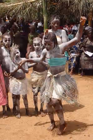 Music of Sierra Leone — students celebrate the opening of a newly rebuilt school with traditional dancing in Koindu, Kailahun District, Sierra Leone