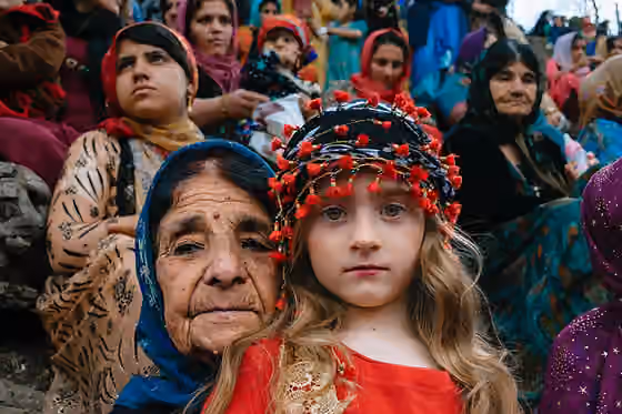 Kurdish population — A grandma and her grandchild watching the “Nowruz” ceremony.