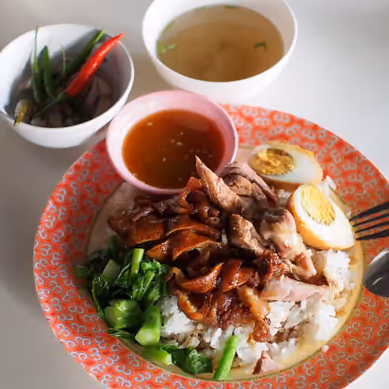Khao kha mu — Khao kha mu (Thai script: ข้าวขาหมู) is steamed rice served with sliced pork trotter which has been simmered in soy sauce and five spice powder.