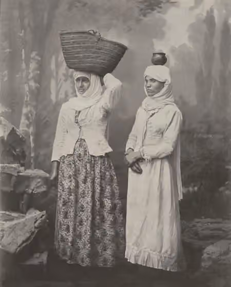 Assyrians in Palestine — Two women from the Assyrian/Syriac Quarter of Bethlehem in Palestine (Hawsh al-Siryan) pose for a studio portrait, c.