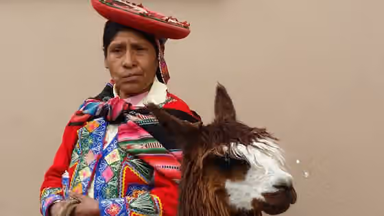 orang Quechua — Peruvian peasant with lama