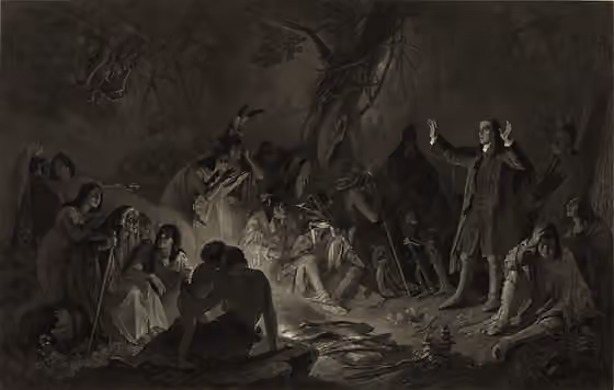 Christian Munsee — Title: Zeisberger preaching to the Indians Abstract: Print shows David Zeisberger, a Moravian missionary, speaking to Indians gathered around a fire.