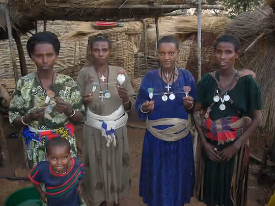 Agaw people — Agaw women of Ethiopia holding spindles for hand-spinning yarn, 2006