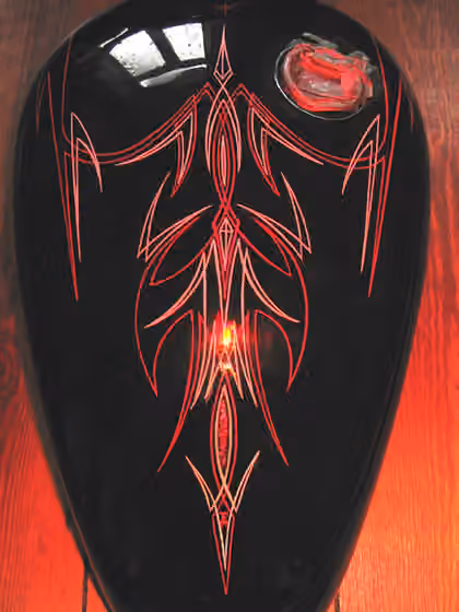 Pinstriping — Pin striping on a motorcycle fuel tank.