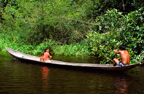 Warao people — A Warao family using a monoxylon on a small Orinoco Delta caño, located near the Monagas border with Delta Amacuro in Venezuela .