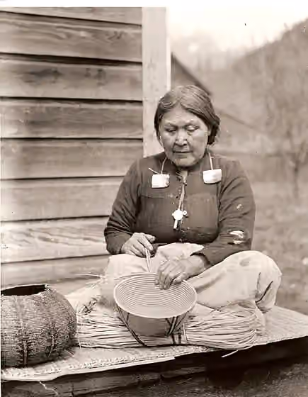 Stó꞉lō — Kwakwaka'wakw woman from 'Yalis; Alert Bay with a cedar basket